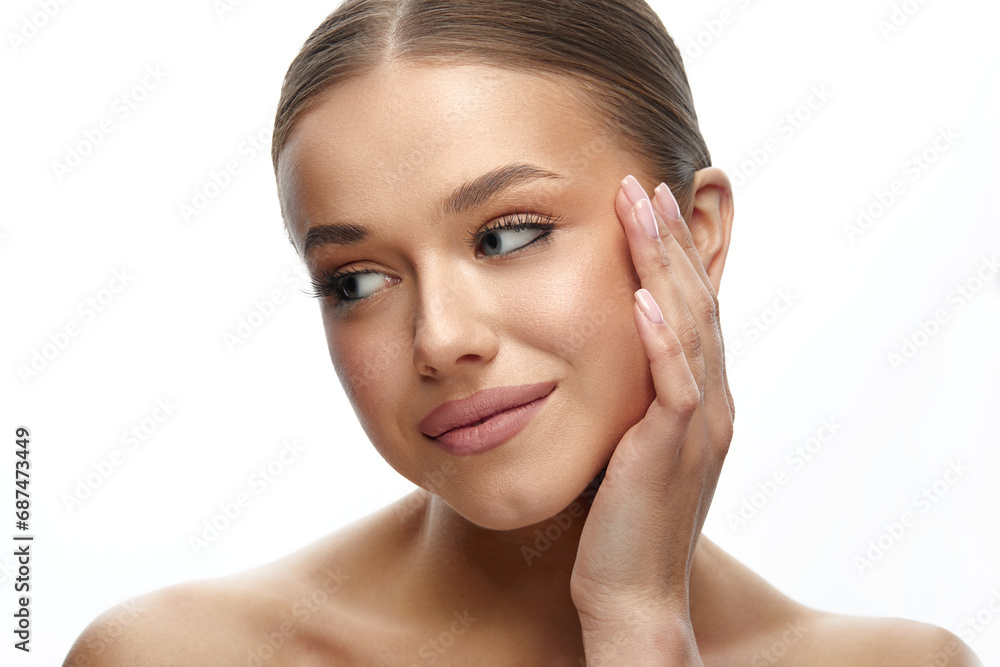 Beauty Face. Smiling Woman Touching Healthy Skin Portrait. Beautiful Girl With Fresh Glowing Facial Skin And Natural Makeup On White Background. Skin Care Concept Beauty Face. Smiling Woman Touching Healthy Skin Portrait. Beautiful Girl With Fresh Glowing Facial Skin And Natural Makeup On White Background. Skin Care Concept