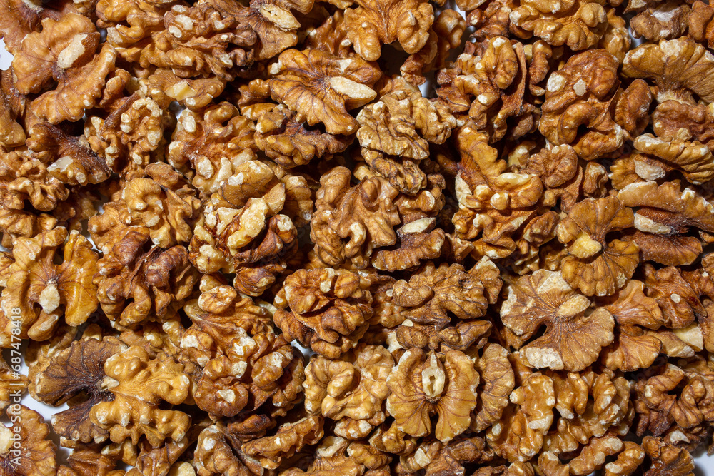 Scattered Shelled Walnuts. Background from Walnut. Natural High-Calorie Snacks Scattered Shelled Walnuts. Background from Walnut. Natural High-Calorie Snacks