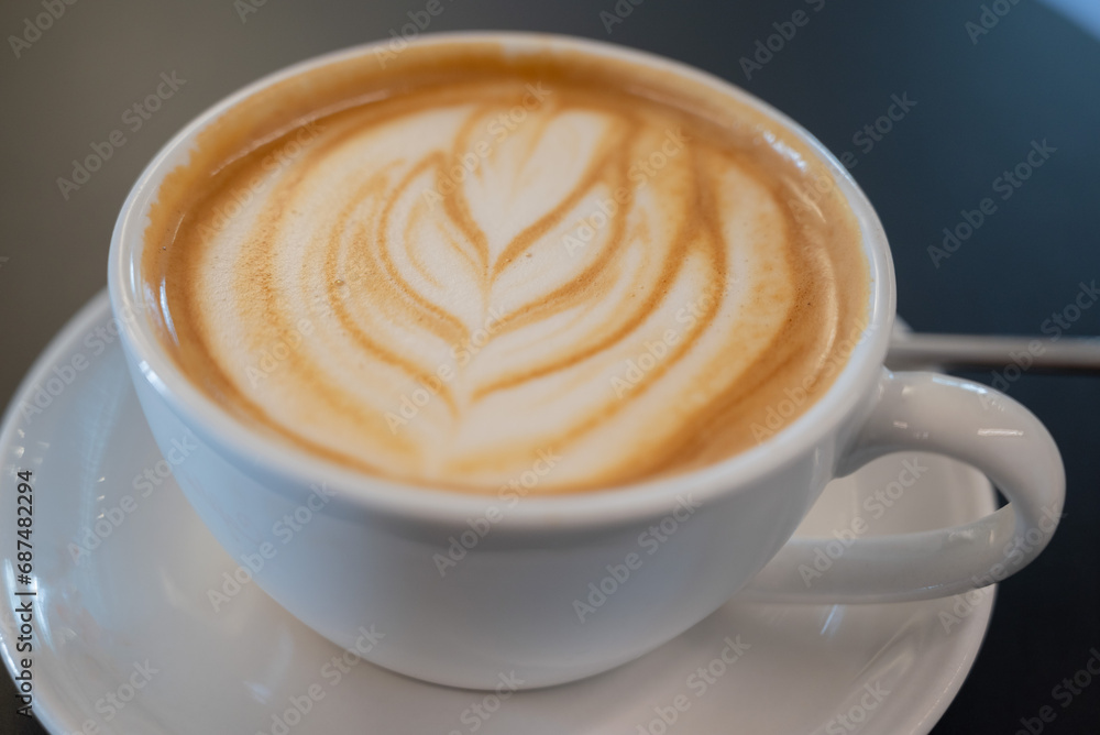 Latte art flower, in a Cappuccino white mug Latte art flower, in a Cappuccino white mug