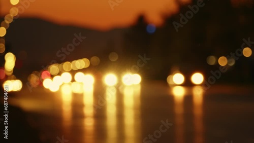 Abstract footage of cars driving on a city boulevard on a hot summer evening by sunset. photo