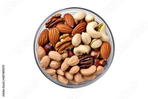 vu de dessus d'un bol rempli d'un assortiment de noix, noix de pécan, cacahouète, noisette, raisins secs et pistache © Sébastien Jouve