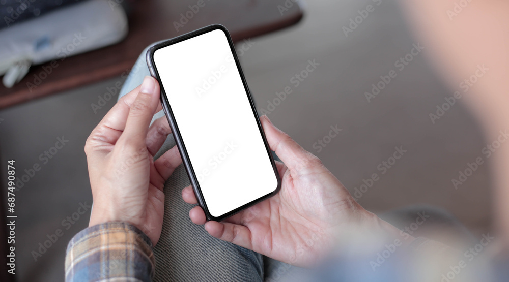 cell phone blank white screen mockup.hand holding texting using mobile on desk at office.background empty space for advertise.work people contact marketing business,technology cell phone blank white screen mockup.hand holding texting using mobile on desk at office.background empty space for advertise.work people contact marketing business,technology