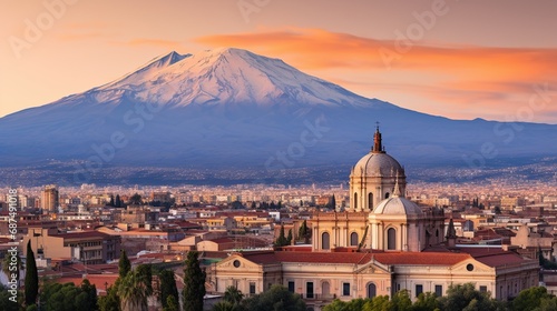 Aerial view of the Catania Saint Agatha's Cathedral by sunset with Mount Etna in the background - Sicily, Italy