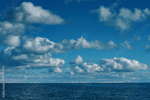 Idyllic view on lake with mountains and clouds