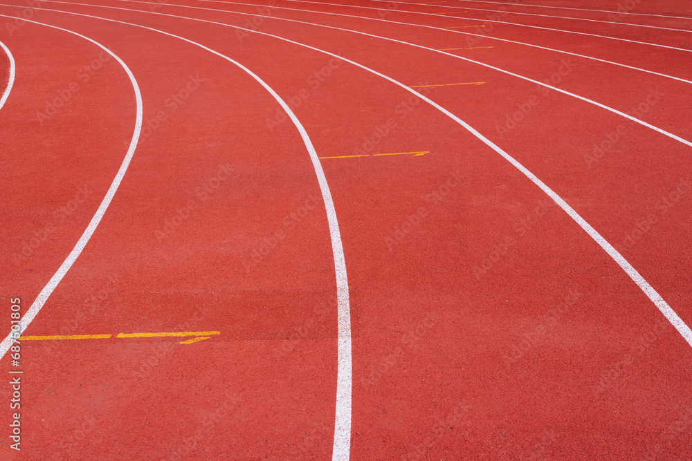 Fototapeta premium running track with lane numbers on the outdoor athletic stadium. 
