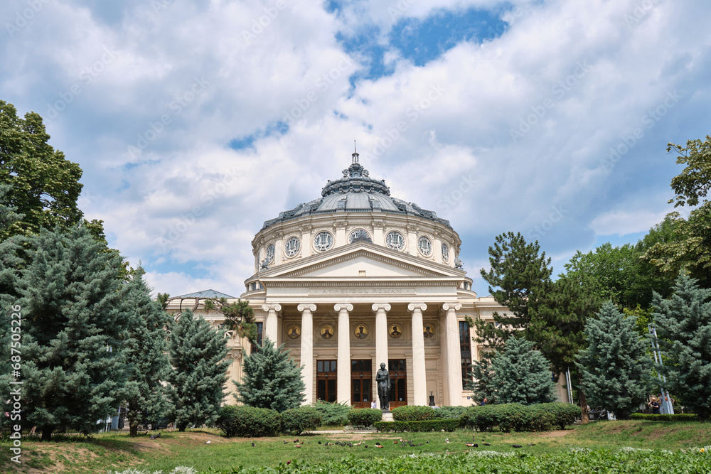 Romanian Athenaeum (Ateneul Roman), a landmark in Bucharest, Romania, with clouds above this domed, circular concert hall building opened in 1888.