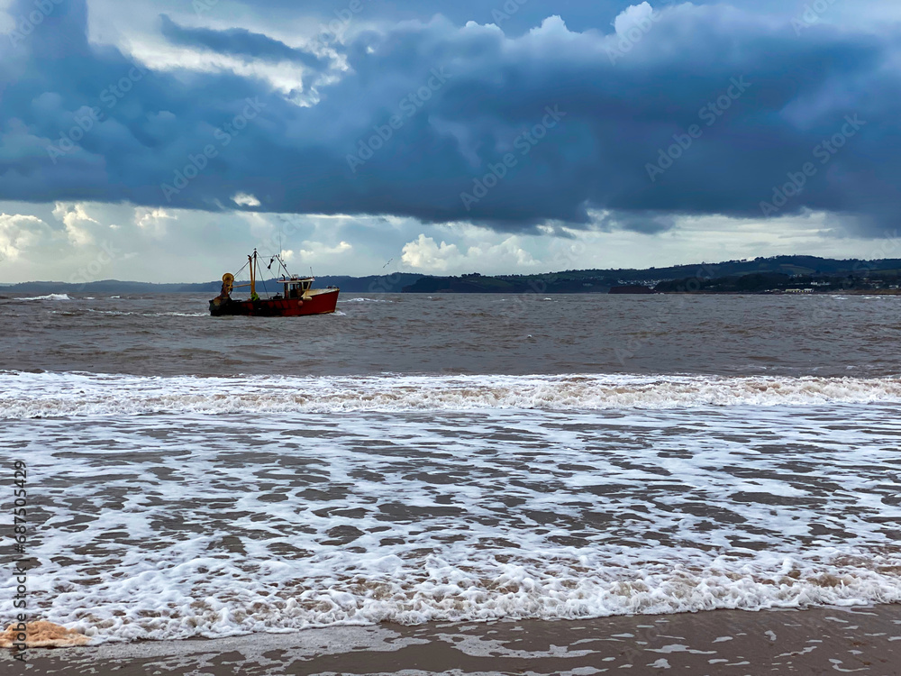Fishing boat at Exmouth beach in East Devon Fishing boat at Exmouth beach in East Devon