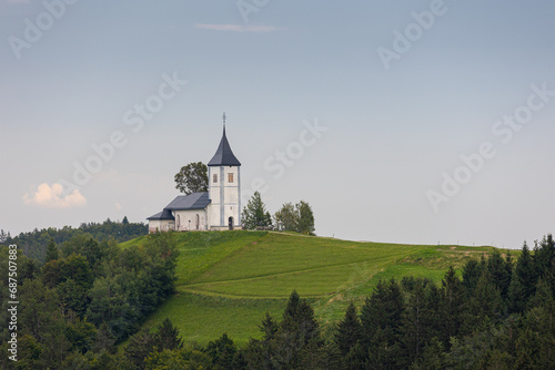 Jamnik, Slovenia. The Jamnik Church is a charming 15th-century chapel in the Kamnik-Savinja Alps near Kranj, breathtaking views of the surrounding mountainous landscape. The Church of St. Primoz