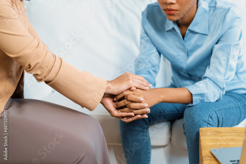 Close up shot of supportive and comforting hands for cheering up depressed patient person or stressed mind with crucial empathy