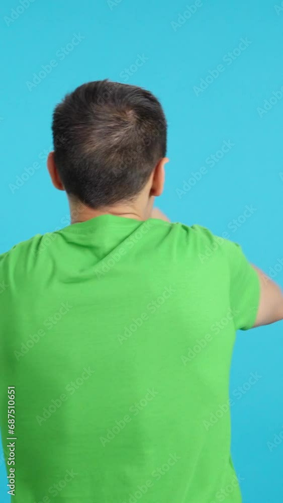 Rear view of a man waving a nigerian pennant Rear view of a man waving a nigerian pennant