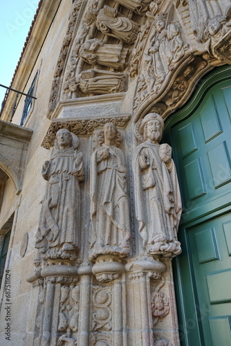 Statues on the facade of the 'Colexio de San Xerome' in Compostela. Saint Francis of Assisi, Saint John the Evangelist and the Apostle Saint James 
Santiago de Compostela, Galicia, Spain 10092023 photo