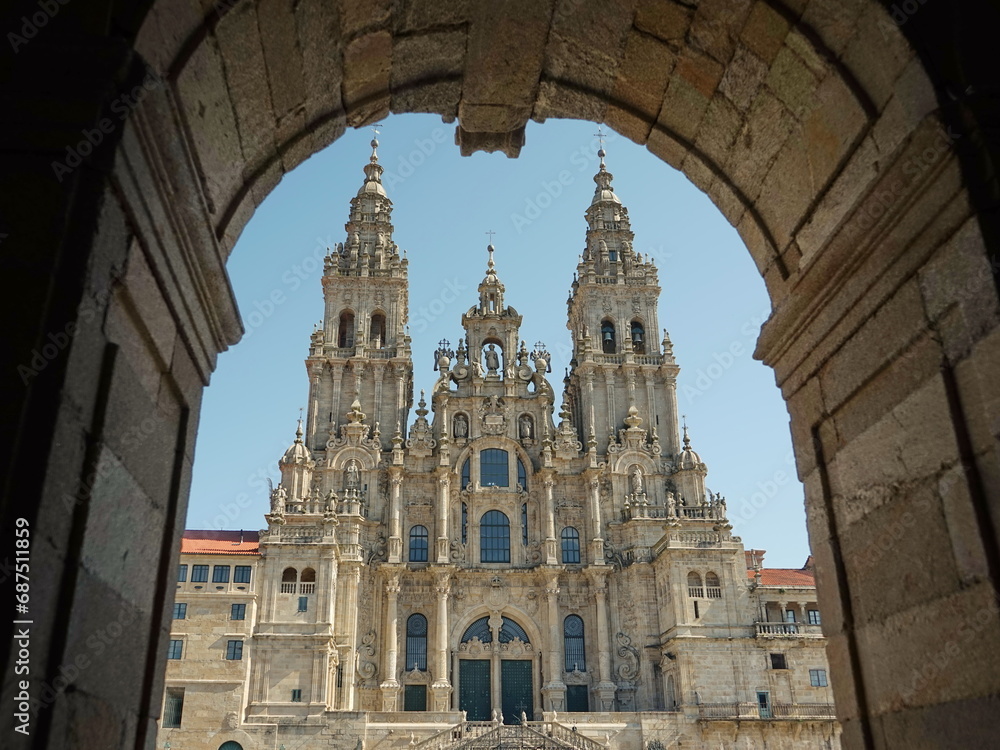 Baroque façade of the 'Praza do Obradoiro' of the Cathedral of Santiago de Compostela seen from the arcades of the 'Pazo de Raxoi' Santiago de Compostela, Galicia, Spain 10092023