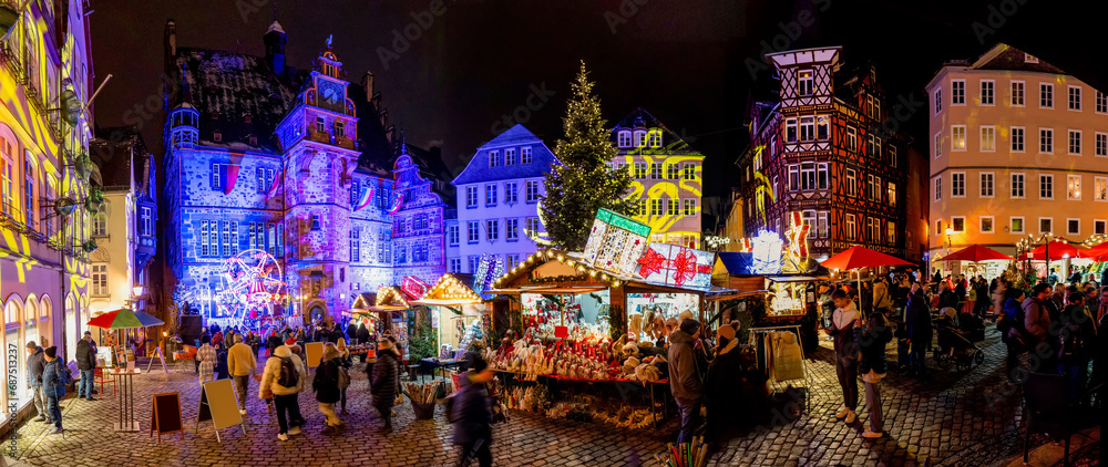 Marburg, panorama of the old market square with Christmas decorations and Christmas huts with beautiful lighting, Traditional Christmas market. Marburg, panorama of the old market square with Christmas decorations and Christmas huts with beautiful lighting, Traditional Christmas market.