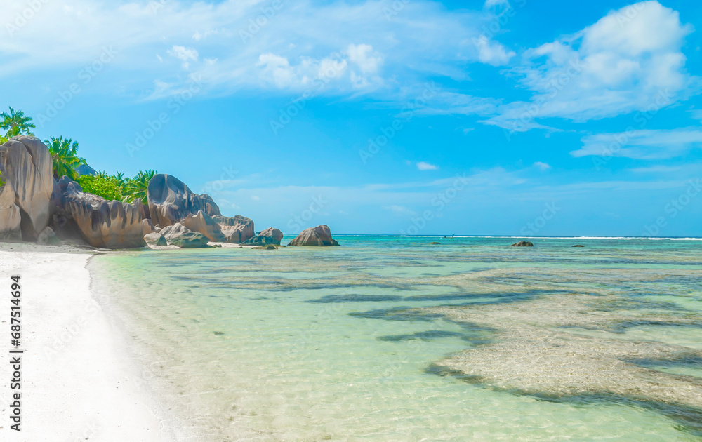 White sand and coral reef in the world famous Anse Source d'Argent beach White sand and coral reef in the world famous Anse Source d'Argent beach
