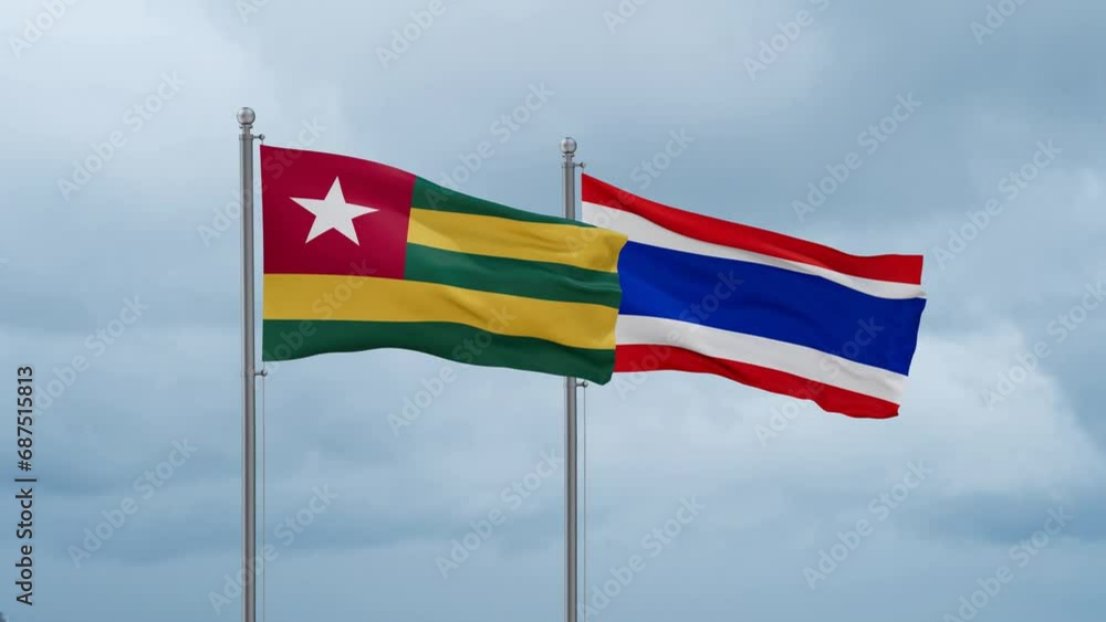 Kingdom of Thailand and Togo flag waving together on cloudy sky, endless seamless loop, two country cooperation concept Kingdom of Thailand and Togo flag waving together on cloudy sky, endless seamless loop, two country cooperation concept