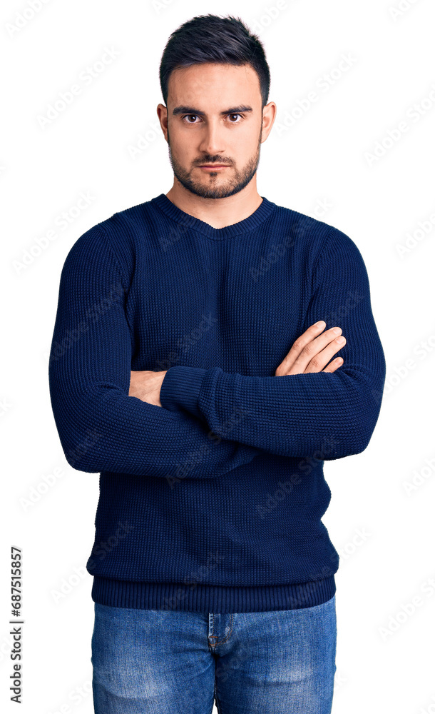 Young handsome man wearing casual clothes skeptic and nervous, disapproving expression on face with crossed arms. negative person. Young handsome man wearing casual clothes skeptic and nervous, disapproving expression on face with crossed arms. negative person.