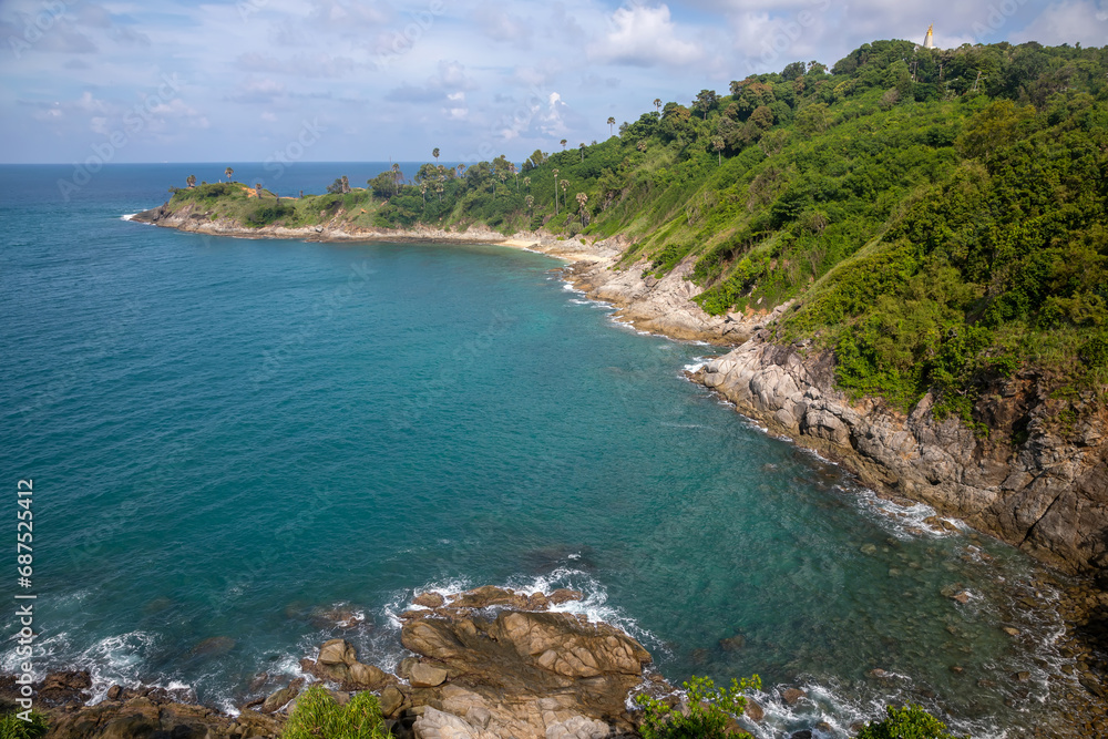 Beautiful marine nature of Thailand. Waves on the ocean. Green tropical island. Blue clear sky.