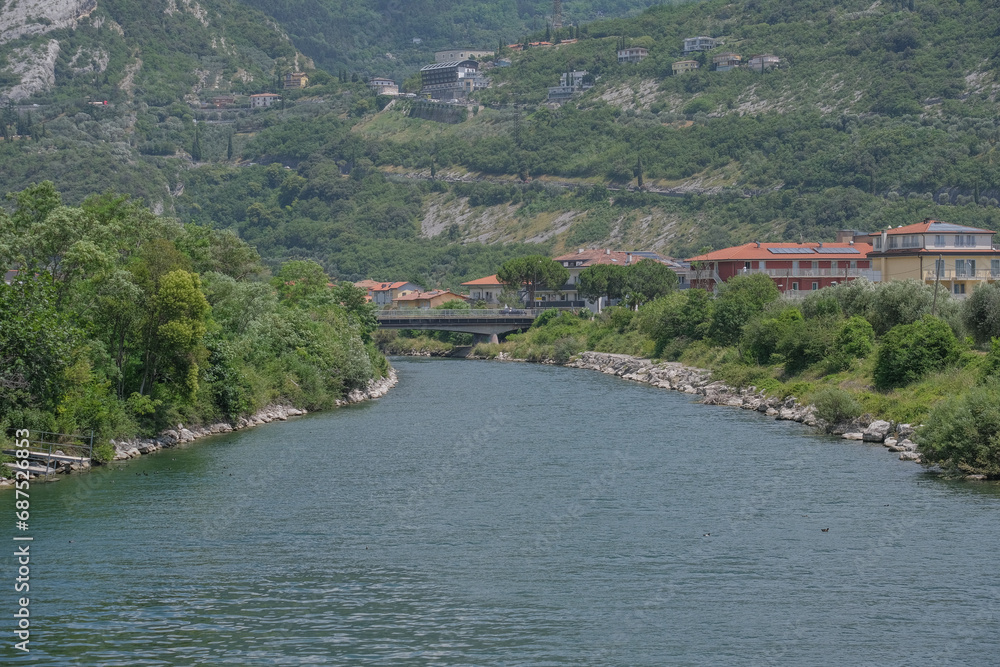 Obraz premium Beautiful landscape in an evening mood by the water in the sunshine. Whether sea, lake or river, water is one of the most beautiful elements of nature. Glistening in the sun, it makes every holiday ev