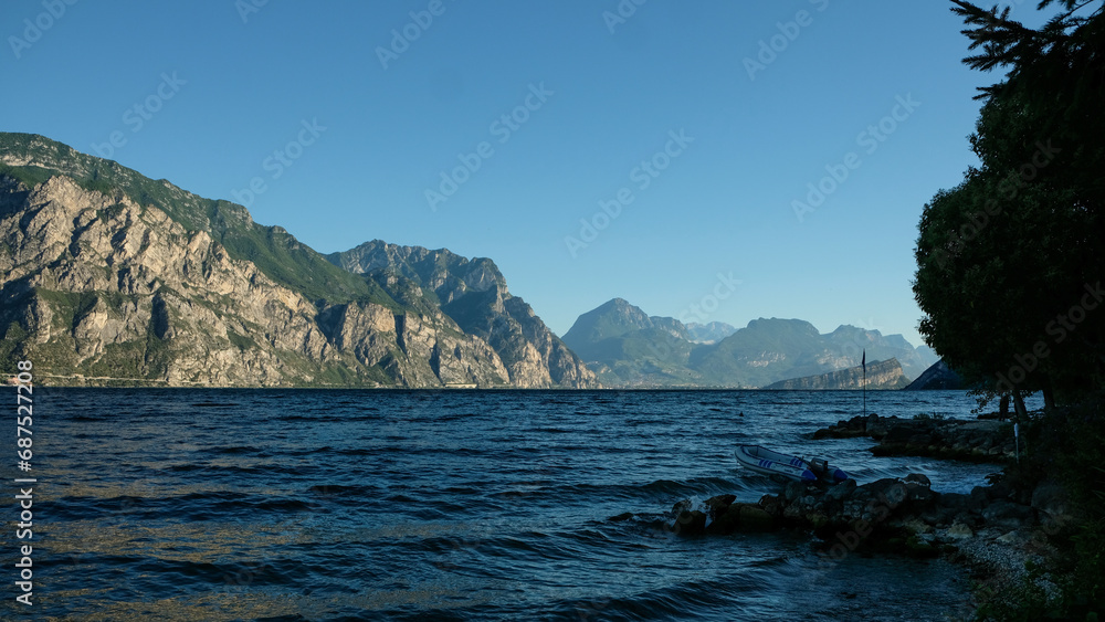Fototapeta premium Beautiful landscape in an evening mood by the water in the sunshine. Whether sea, lake or river, water is one of the most beautiful elements of nature. Glistening in the sun, it makes every holiday ev