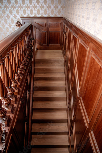 Interior of the house. Classic wooden staircase.