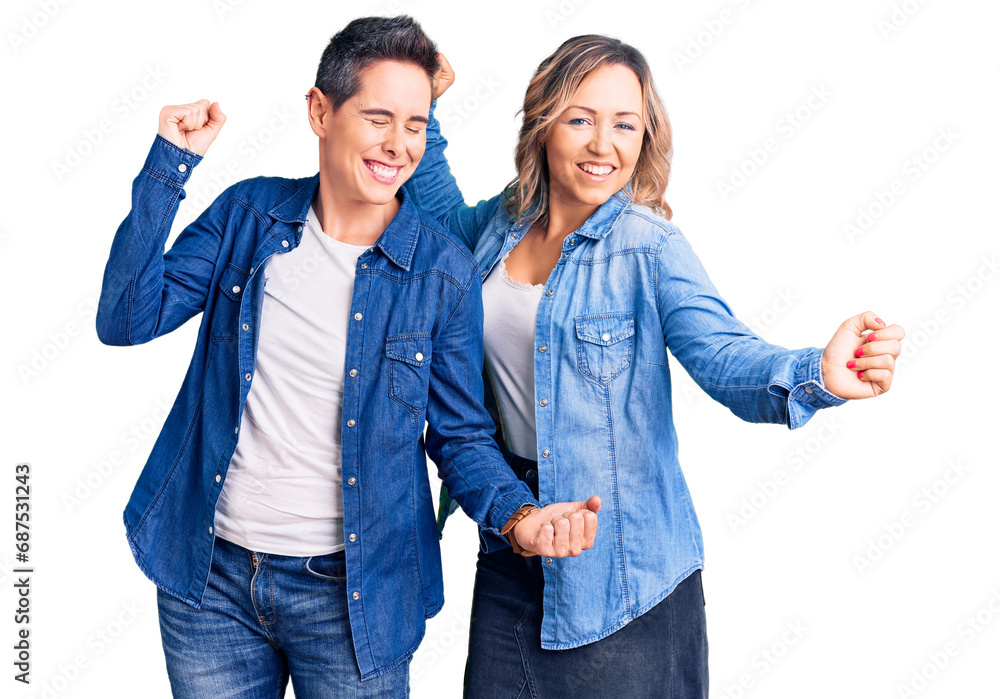 Couple of women wearing casual clothes dancing happy and cheerful, smiling moving casual and confident listening to music Couple of women wearing casual clothes dancing happy and cheerful, smiling moving casual and confident listening to music