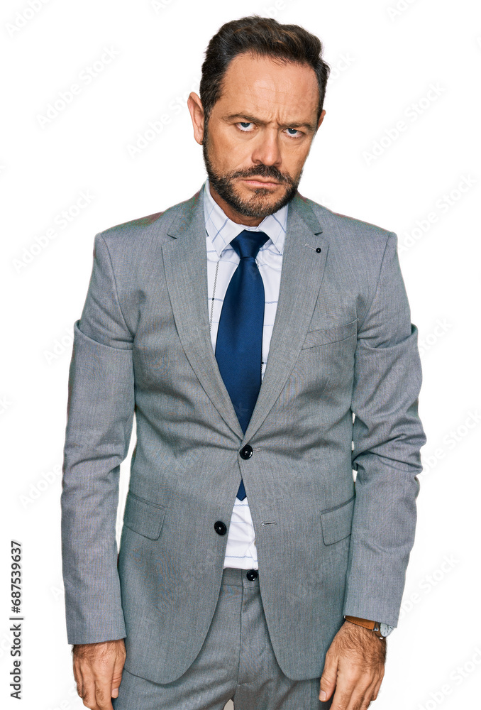 Fototapeta premium Middle age man wearing business clothes looking sleepy and tired, exhausted for fatigue and hangover, lazy eyes in the morning.