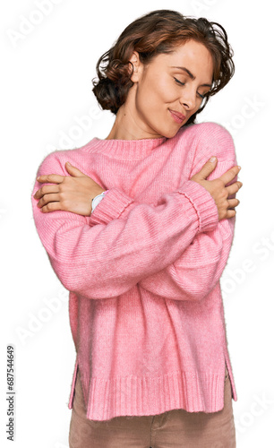 Young hispanic woman wearing casual clothes hugging oneself happy and positive, smiling confident. self love and self care