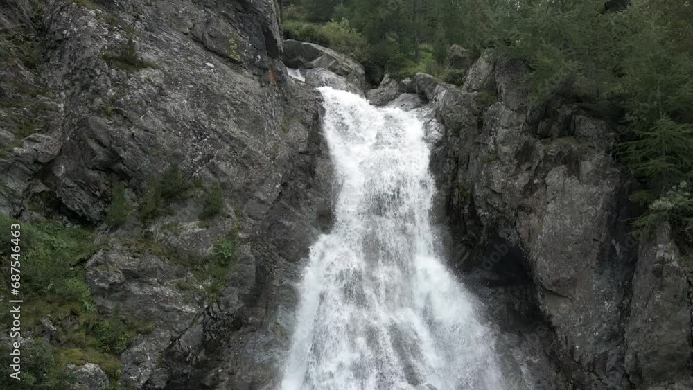 Aerial zoom out of Val Nera Waterfall in Livigno Italian Alps Aerial zoom out of Val Nera Waterfall in Livigno Italian Alps