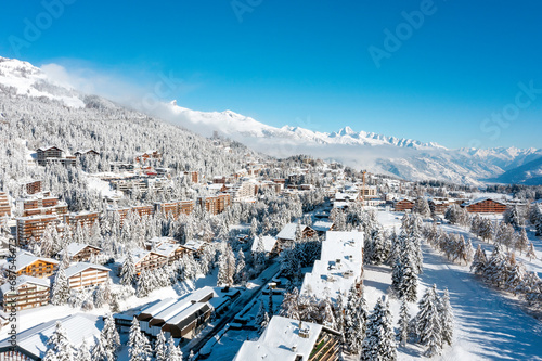 Billede på lærred drone view of the ski resort of Crans Montana covered by snow in winter