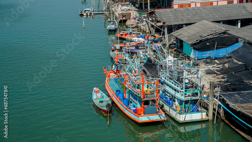 Maine Fishing Village at Pak Nam Prasae Fisherman Village, Rayong Province, Thailand. View of a fishing village on the water, cottages on stilts.