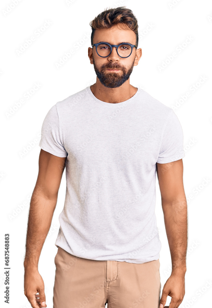 Young hispanic man wearing casual clothes and glasses puffing cheeks with funny face. mouth inflated with air, crazy expression. Young hispanic man wearing casual clothes and glasses puffing cheeks with funny face. mouth inflated with air, crazy expression.