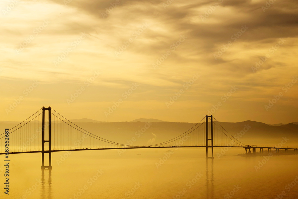 The Osman Gazi Bridge is a suspension bridge spanning the Gulf of İzmit. The bridge links the Turkish city of Gebze to the Yalova Province and carries the motorway across the gulf The Osman Gazi Bridge is a suspension bridge spanning the Gulf of İzmit. The bridge links the Turkish city of Gebze to the Yalova Province and carries the motorway across the gulf