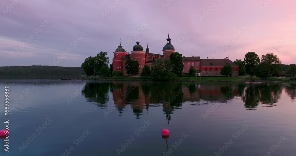 Aerial: Drone Forward Scenic Shot Of Famous Medieval Castle In Lake Malaren During Sunset - Mariefred, Sweden Aerial: Drone Forward Scenic Shot Of Famous Medieval Castle In Lake Malaren During Sunset - Mariefred, Sweden