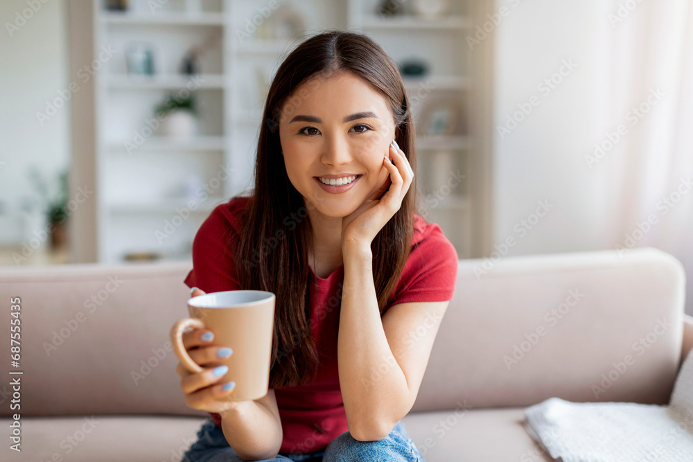 Domestic Leisure. Happy Smiling Asian Woman Drinking Coffee At Home Domestic Leisure. Happy Smiling Asian Woman Drinking Coffee At Home