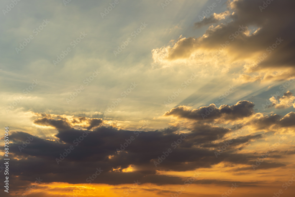 Fototapeta premium The blue sky is orange and the clouds are soft when the sun is about to set.