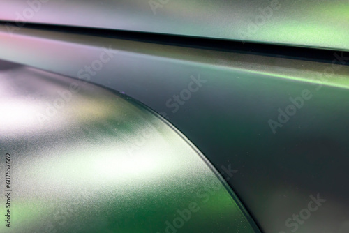 Abstract background with purple and green curved shapes.