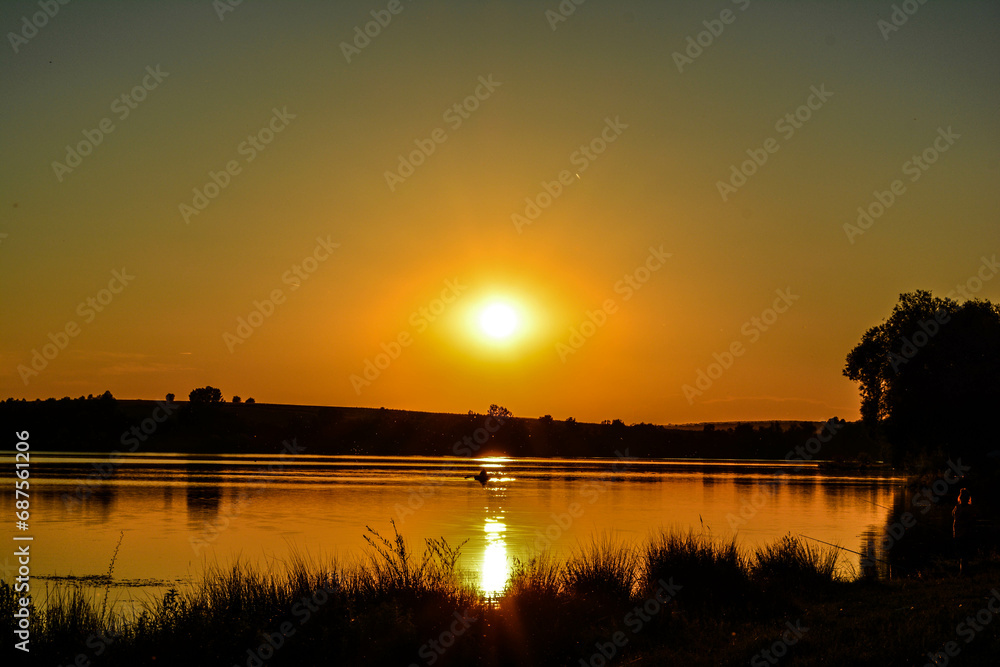 Naklejka premium sunset over lake
