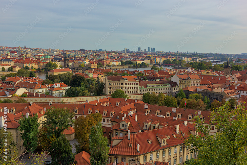 Panoramic view of the city of Prague from the observation deck. Streets and architecture of the old city. Romantic town panorama, historical buildings, red roofs, churches.