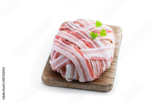 Raw italian bacon wrapped meatloaf isolated on white