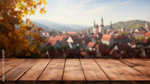 Empty wooden table top with Scandinavia village or traditional European town/city background and Autumn leaves. Autumn Themed. Bokeh style background. Stage for product design. Generative AI photo