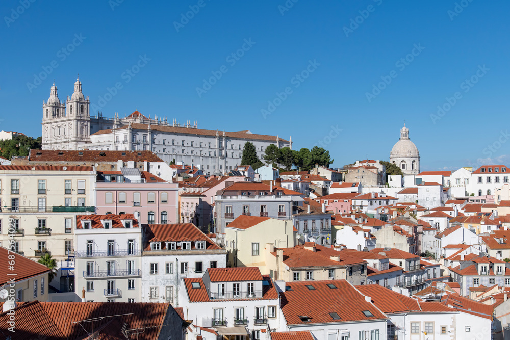 View of Alfama neighborhood Lisbon, Portugal with on hill Monastery of São Vicente de Fora and Church of Santa Engrácia (Igreja de Santa Engrácia), originally  National Pantheon in background