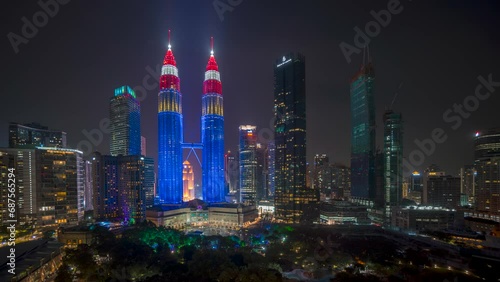 4k time lapse of night scene on Independence eve day at Kuala Lumpur city center with fireworks and light show. 