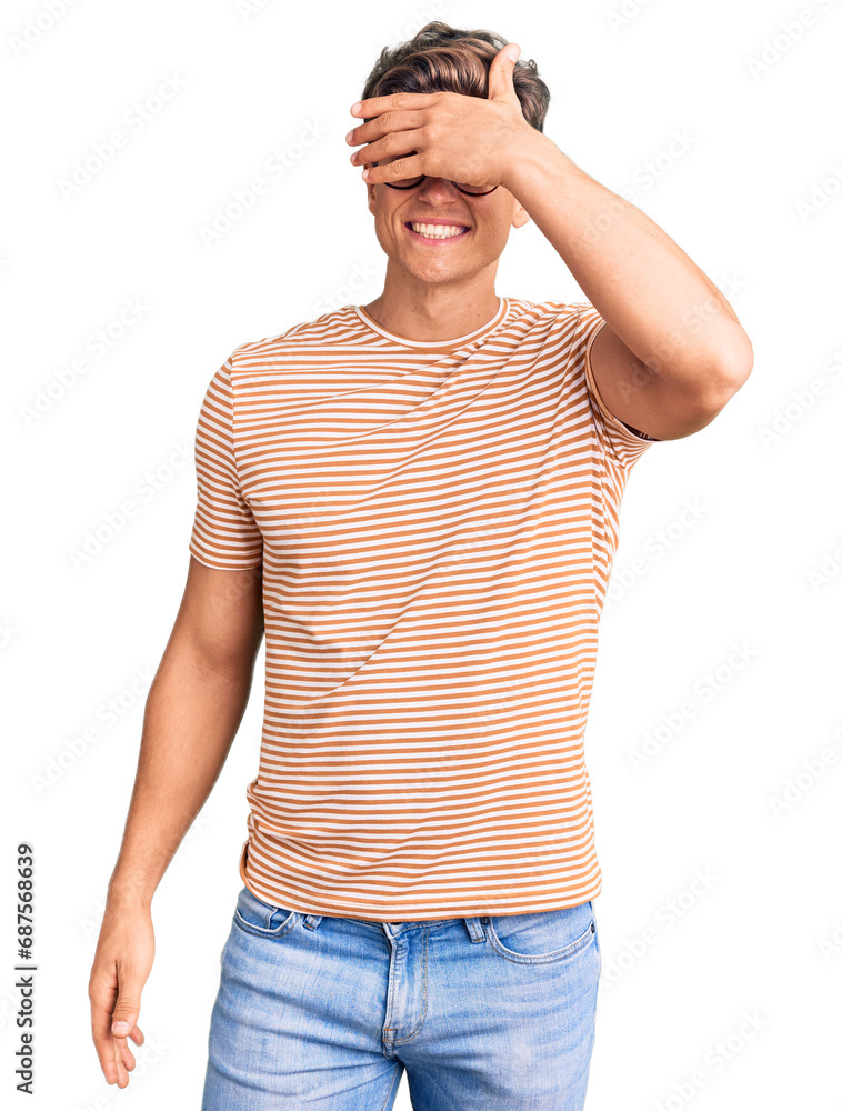 Young handsome man wearing casual clothes and glasses smiling and laughing with hand on face covering eyes for surprise. blind concept. Young handsome man wearing casual clothes and glasses smiling and laughing with hand on face covering eyes for surprise. blind concept.