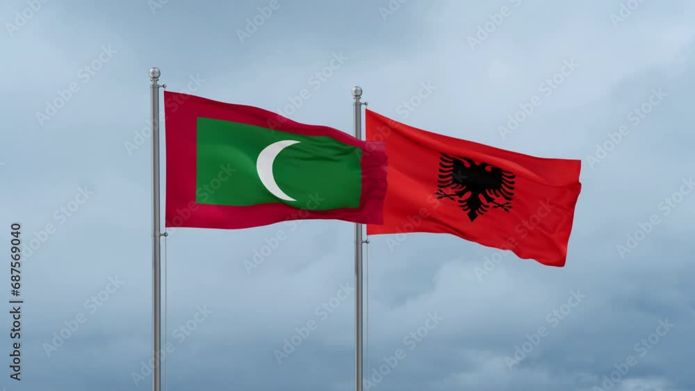 Maldives flag and Albania flag waving together on cloudy sky, endless seamless loop Maldives flag and Albania flag waving together on cloudy sky, endless seamless loop