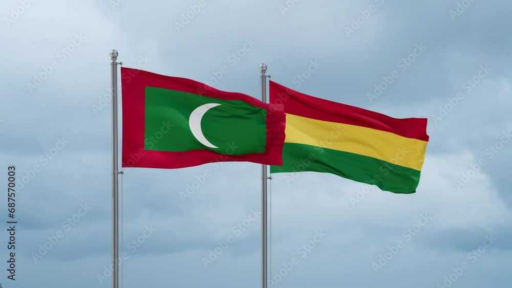 Bolivia flag and Maldives flag waving together on cloudy sky, endless seamless loop, two country relations concept Bolivia flag and Maldives flag waving together on cloudy sky, endless seamless loop, two country relations concept