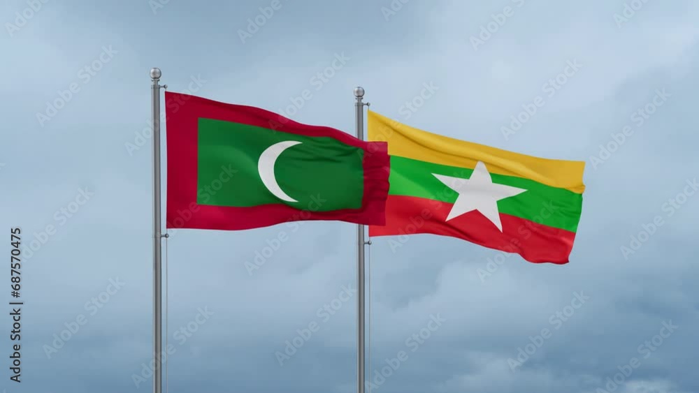 Myanmar aka Burma flag and Maldives flag waving together on cloudy sky, endless seamless loop, two country relations concept Myanmar aka Burma flag and Maldives flag waving together on cloudy sky, endless seamless loop, two country relations concept