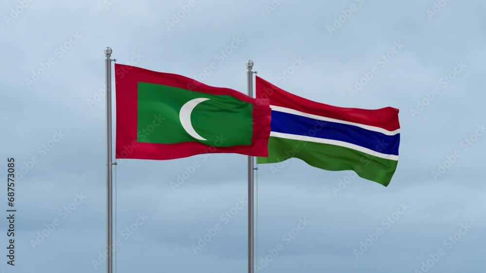 Gambia flag and Maldives flag waving together on cloudy sky, endless seamless loop, two country relations concept Gambia flag and Maldives flag waving together on cloudy sky, endless seamless loop, two country relations concept