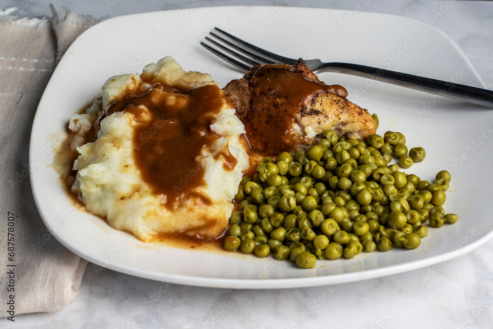 baked chicken thigh covered with gravy with mashed potatoes baked chicken thigh covered with gravy with mashed potatoes