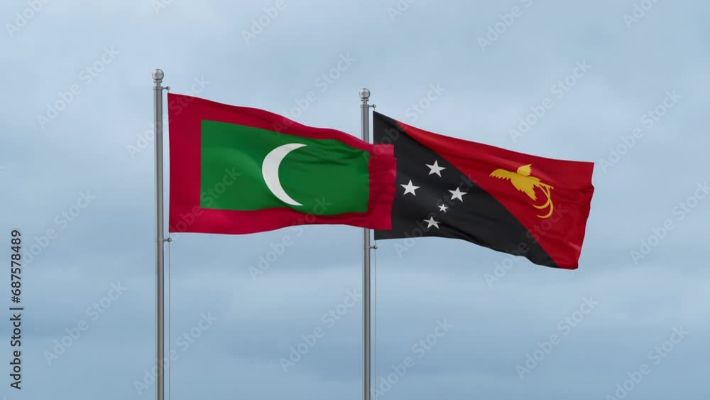 Papua New Guinea flag and Maldives flag waving together on cloudy sky, endless seamless loop, two country relations concept Papua New Guinea flag and Maldives flag waving together on cloudy sky, endless seamless loop, two country relations concept