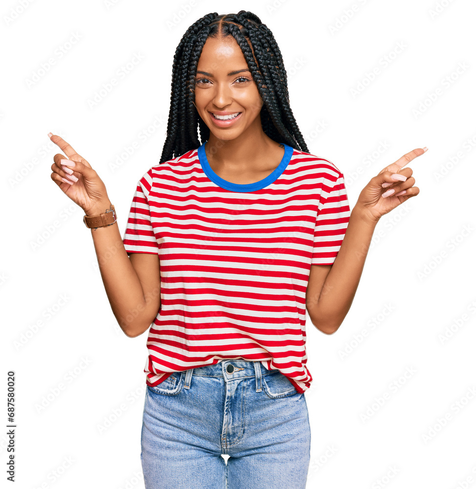 Beautiful hispanic woman wearing casual clothes smiling confident pointing with fingers to different directions. copy space for advertisement Beautiful hispanic woman wearing casual clothes smiling confident pointing with fingers to different directions. copy space for advertisement